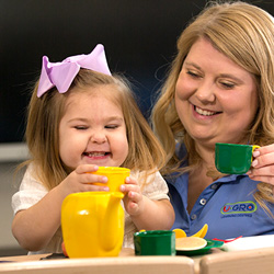 teacher and child laughing