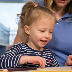 young girl working on puzzle